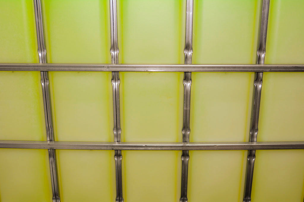 DOWFROST HD Inhibited Propylene Glycol in a 275 Gallon Tote. Bright yellow to green in color.